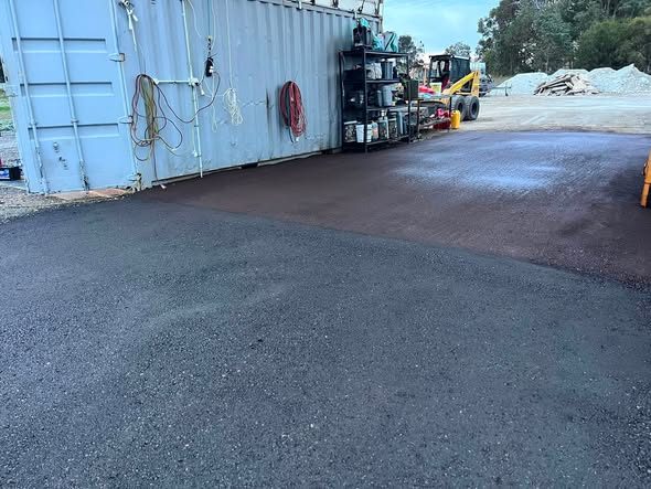 Truck hardstand drainage and fresh crushed asphalt: photo 1