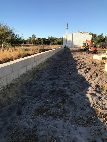 60 m limestone wall with core-drilled Colorbond fence: photo 2