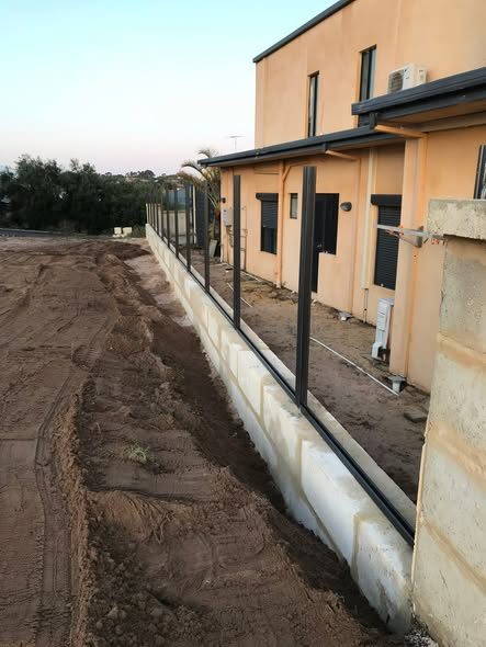 Ocean-front fence replaced with limestone and Colorbond: photo 3